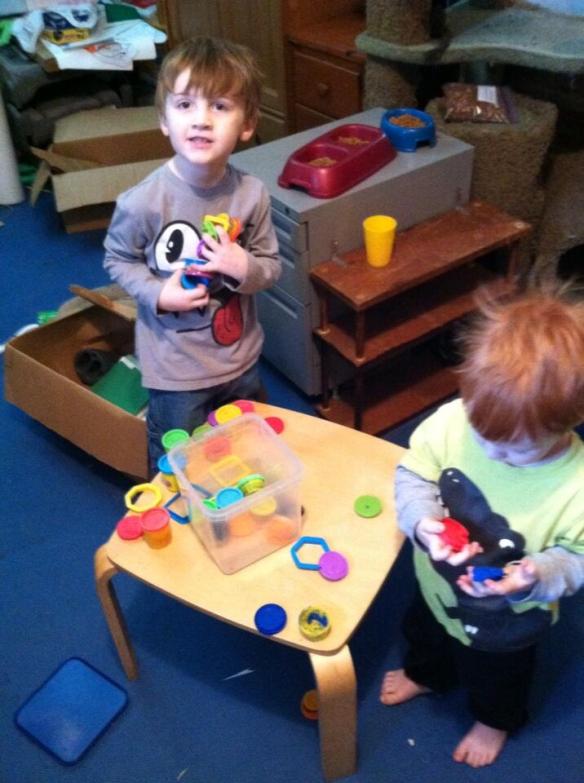 The guys take a Play-Doh break while helping Mom & Dad clean and organize the garage.